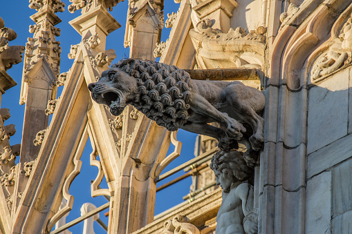 The cathedral of Milan is sprinkled with 3400 statues and more than 700 figures in the high reliefs of marble