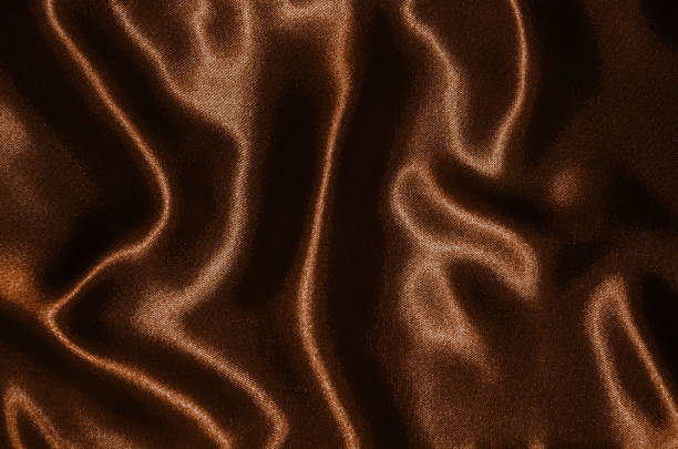 istock Background and wallpaper by brown fabric and stripe textile. 1017628394