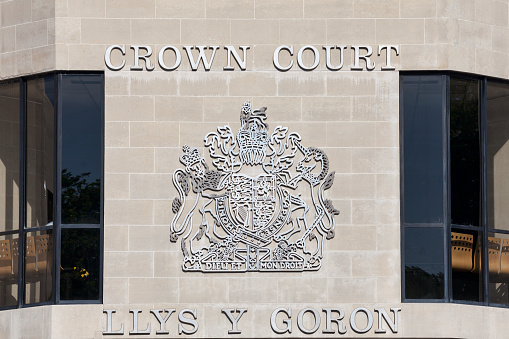 Swansea, Wales, UK, June 30, 2018 : Swansea Crown Court sign in St Helen's Road which is the highest court of first instance in criminal cases