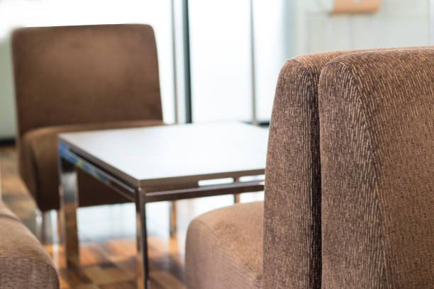 istock Beautiful texture of the brown fabric sofa around with center table 1017636720