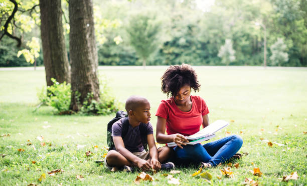 istock sister doing the homework with the little brother 1017641482