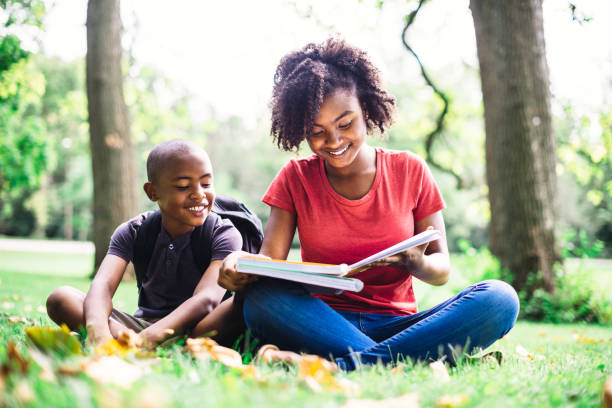 istock sister doing the homework with the little brother 1017641528