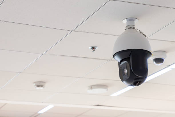 istock high security camera hang on the white ceiling at the airport 1017642034