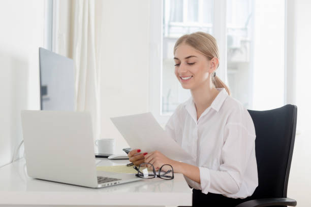 istock Businesswoman doing paperwork at office 1017644488