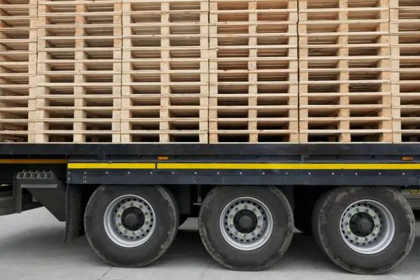 Stack of wooden timber pallets on truck for transportation  uk