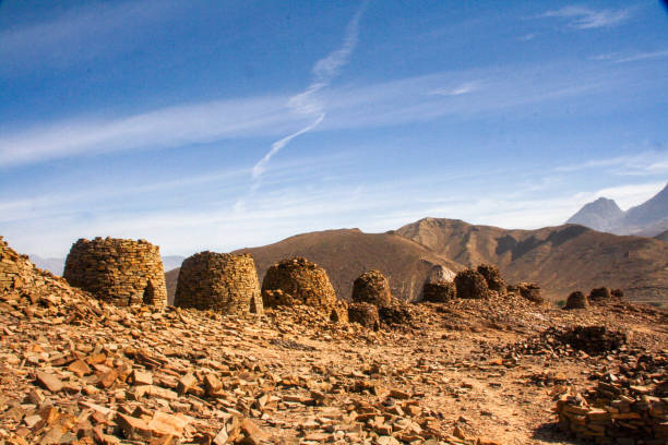 5000-year-old stone 'beehive' tombs at the UNESCO world heritage site of Bat in Oman 5000-year-old stone 'beehive' tombs at the UNESCO world heritage site of Bat in Oman beehive photos stock pictures, royalty-free photos & images