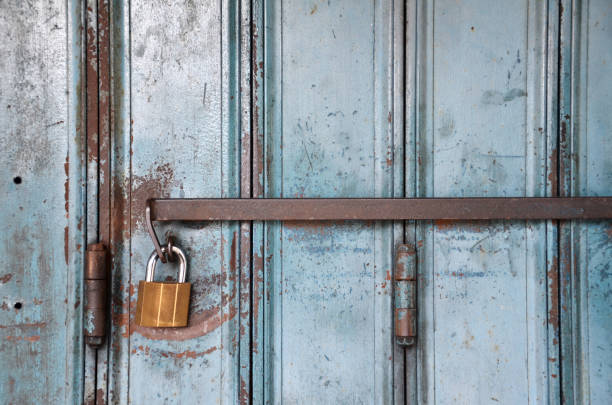 istock Metal lock on a blue door 1017658438