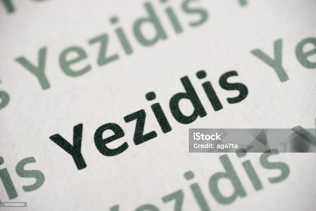 word Yezidis  printed on paper macro word Yezidis printed on white paper macro Yazidi Stock Photo