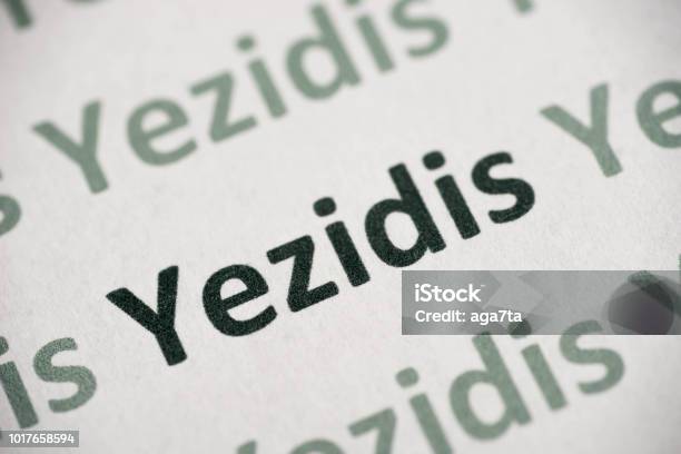 Word Yezidis Printed On Paper Macro Stock Photo - Download Image Now - Yazidi, Abstract, Alphabet