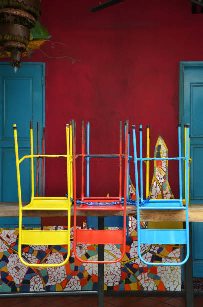 istock Colorful chairs on a wooden table 1017658810