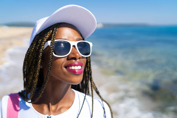 istock African woman enjoying summer vacations 1017658978