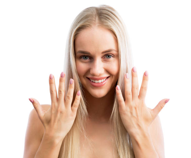 Beautiful woman showing her hands after a manicure