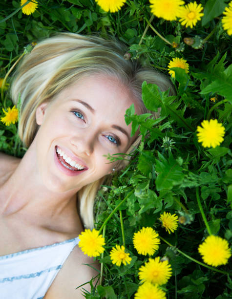 istock Woman among dandelions 1017663414