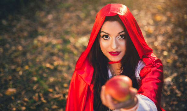 istock Little red riding hood in a forest 1017666338