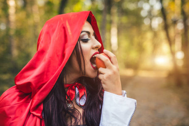 istock Little red riding hood in a forest 1017666462