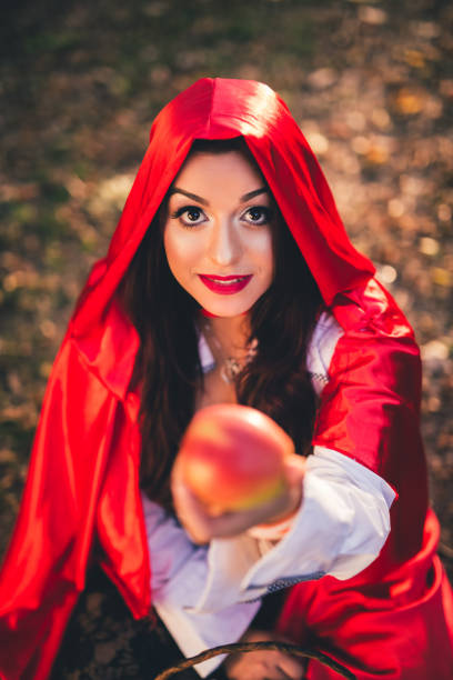 istock Little red riding hood in a forest 1017666550