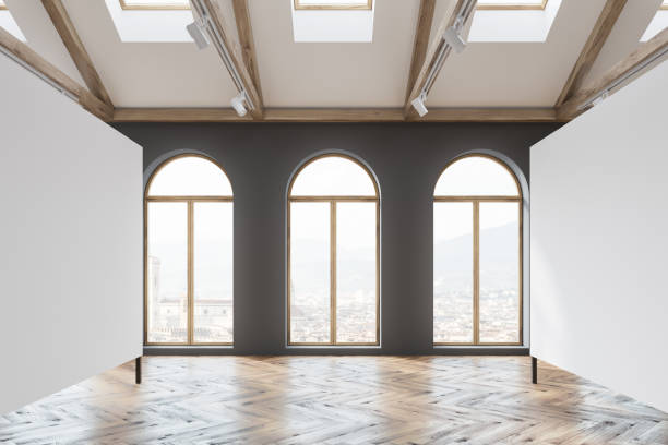 istock Mock up poster gallery in attic, arched windows 1017666754