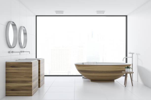 istock White bathroom interior, wooden tub and sink 1017666822