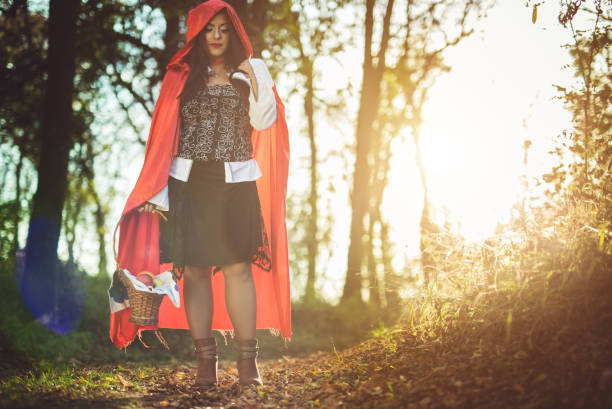 istock Little red riding hood in a forest 1017669382