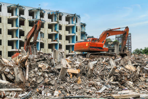 istock Excavator in demolition of housing 1017675940