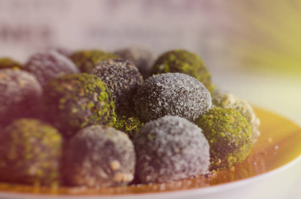 istock Coconut and pistachio covered chocolate balls dessert 1017676368