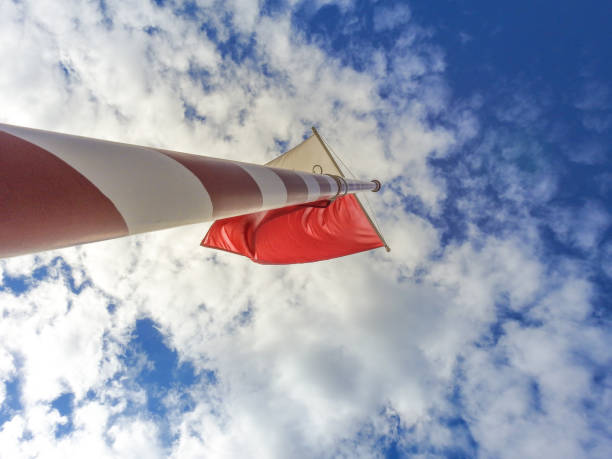 Empty mast with a clear sky on the background.