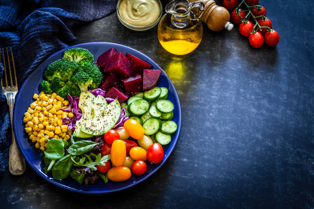 istock Salad mix plate shot from above on dark table 1017691760
