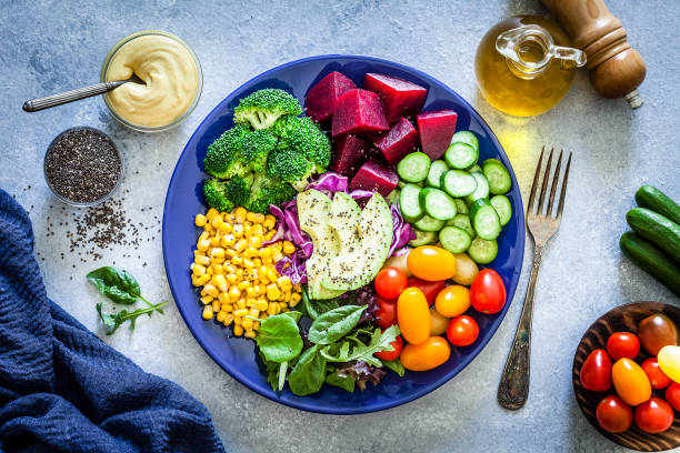 istock Salad mix plate shot from above on light gray marble table 1017692086