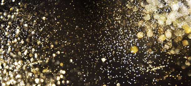 istock Golden (Christmas, New Year) Glitter Lights Defocused Background 1017692576