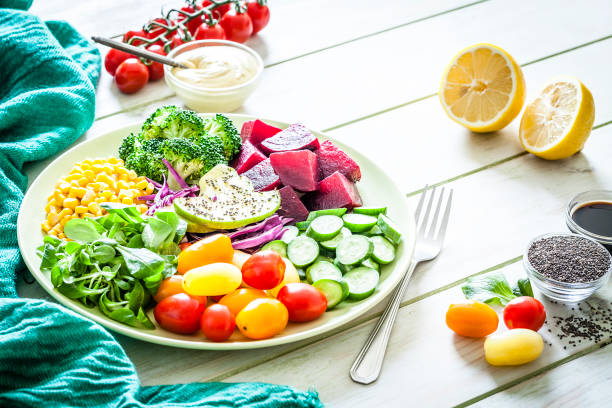 istock Salad mix plate shot on light green picnic table 1017706766
