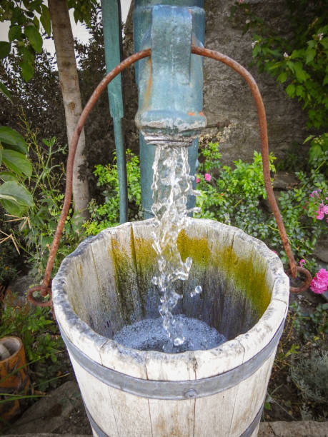 istock Old fountain with flowing water 1017713842