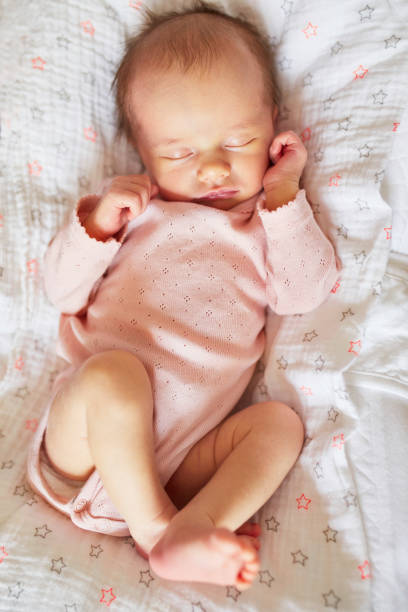 istock Newborn baby girl sleeping 1017718990