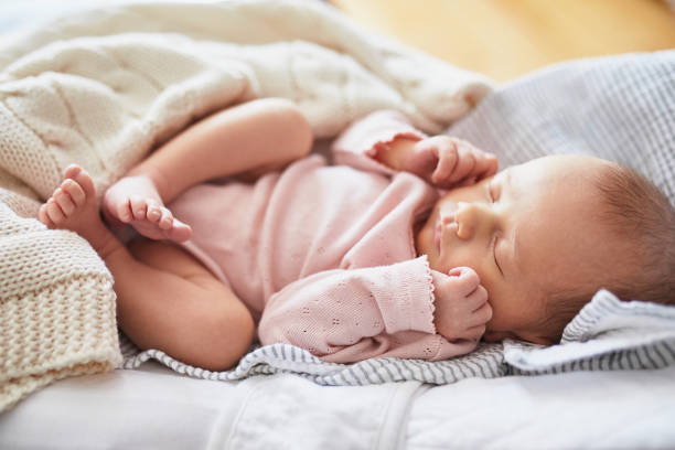 istock Newborn baby girl sleeping 1017719006
