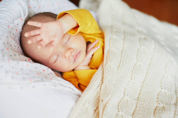 istock Newborn baby girl sleeping 1017719030
