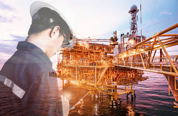 istock Double exposure of Engineer or Technician man with industry tool icons for management business by using tablet with safty helmet & uniform for oil and gas industrial business concept. 1017721860