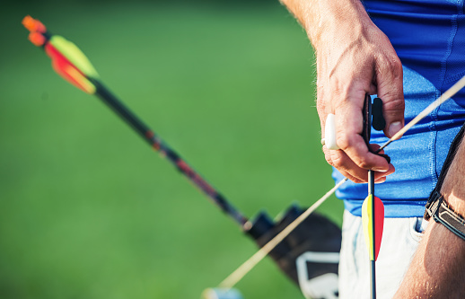 Archery. Archer exercise with the bow. Sport, recreation concept