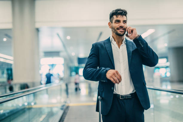 istock Travelling businessman making phone call 1017754324