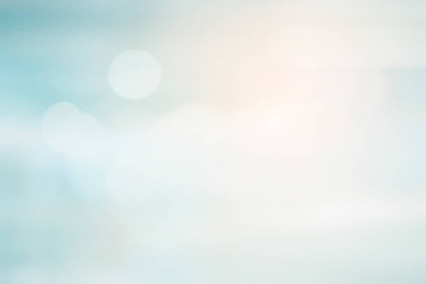 istock abstract blurred beautiful soft blue color sky background with double exposure of bokeh light for design element 1017778590