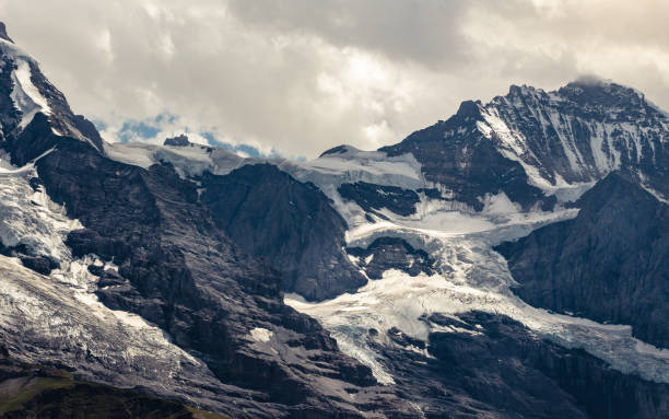 istock Jungfraujoch and mt Jungfrau and dramatic clouds, Switzerland 1017779082