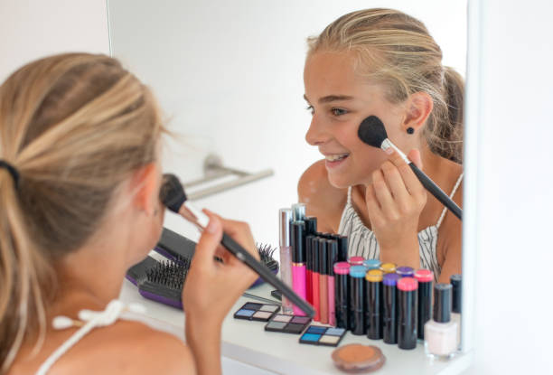 istock teenager applying makeup 1017782714