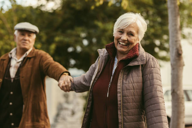 istock Happy senior couple walking outdoors on a winter day 1017787916