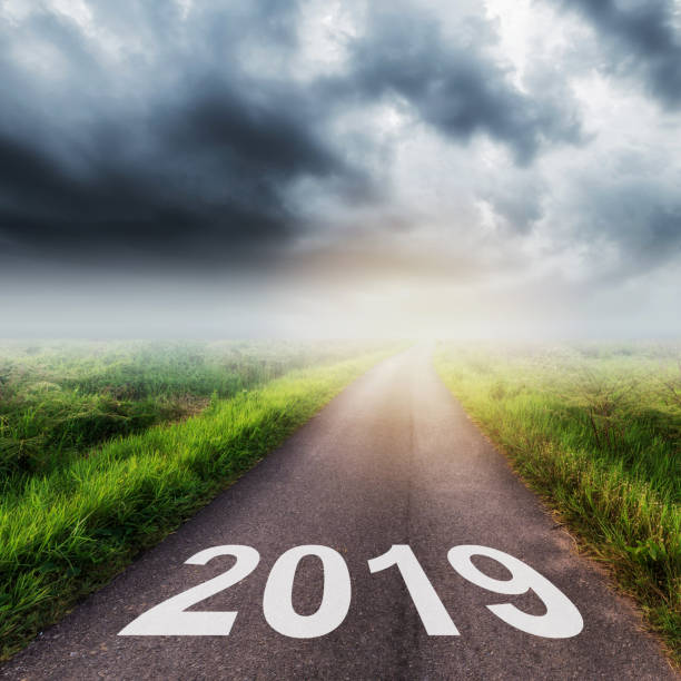 istock Empty asphalt road and New year 2019 concept. Driving on an empty road to Goals 2019. 1017788146