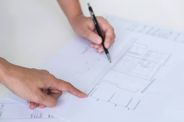 istock Architect working on blueprint, Engineer meeting working with partner colleagues and engineering tools for architectural project, Construction concept 1017791466