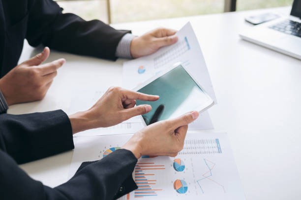 istock Business team working with computer, tablet and document graph in team Meeting Talking Discussion Brainstorming Communication Concept 1017791486