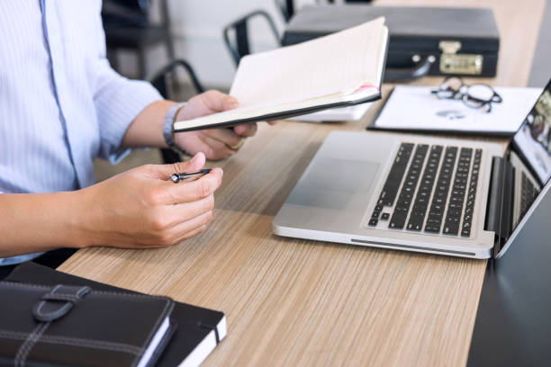 istock Professional businessman working at workplace with report, Doing finance on laptop, document graph and analysis business strategy to development profit 1017791488