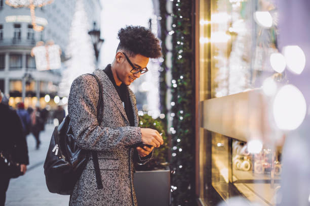 istock Young man is shopping for Christmas presents 1017793590