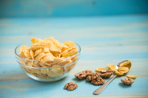 istock Tasty cornflakes with walnut in glass bowl 1017796466
