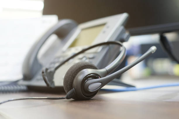 istock close up soft focus on telephone devices at office desk for customer service support concept 1017801544