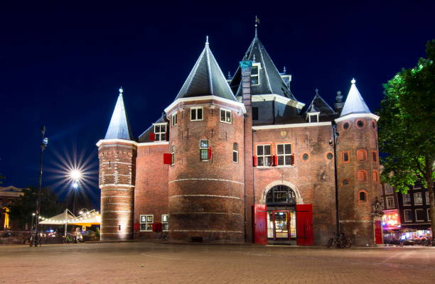istock De Waag (weigh house) in Amsterdam at night, Netherlands 1017818720