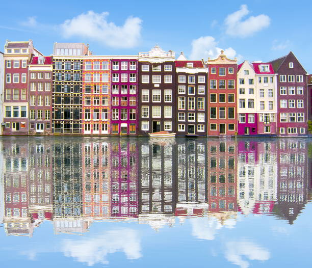 istock Amsterdam architecture and Damrak canal, Netherlands 1017818882
